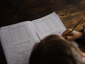 Child completing maths homework.