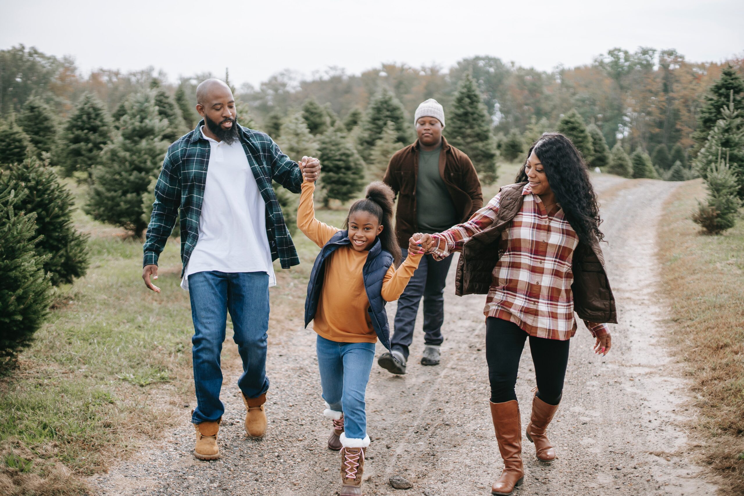 Parents walking with children holding hands.